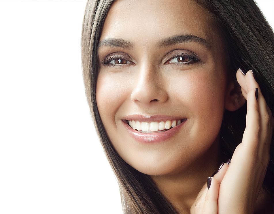A woman smiling with radiant skin